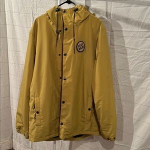 Snowboard jacket small tear by bottom button